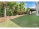 The backyard features a grassy lawn and a deck with stairs at 13519 Crystal Springs Dr # 148, Huntersville, NC 28078