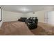 The basement features a home theater with plush leather reclining seating at 13519 Crystal Springs Dr # 148, Huntersville, NC 28078
