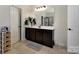 Well-lit bathroom boasts a modern vanity, stylish fixtures, and neutral decor for a serene atmosphere at 13519 Crystal Springs Dr # 148, Huntersville, NC 28078