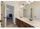 Bathroom features a double sink vanity and a door leading to the bedroom at 13519 Crystal Springs Dr # 148, Huntersville, NC 28078
