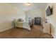 Cozy bedroom with a dark metal bed frame, dresser and bedside table at 13519 Crystal Springs Dr # 148, Huntersville, NC 28078