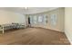 Bonus room features ping pong table, punching bag, and great natural light at 13519 Crystal Springs Dr # 148, Huntersville, NC 28078