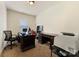 Comfortable home office space with two desks, a computer, and natural light at 13519 Crystal Springs Dr # 148, Huntersville, NC 28078