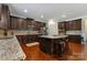 Modern kitchen featuring granite countertops, stainless steel appliances, and a large island at 13519 Crystal Springs Dr # 148, Huntersville, NC 28078