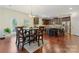 Eat-in kitchen featuring stainless appliances, large island with seating and dark cabinetry at 13519 Crystal Springs Dr # 148, Huntersville, NC 28078