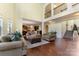 Spacious living room featuring a second floor gallery, dark wood floors and lots of light at 13519 Crystal Springs Dr # 148, Huntersville, NC 28078