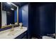 Stylish powder room features modern fixtures, elegant mirror, and vanity at 1419 Jules Ct, Charlotte, NC 28226