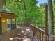 This beautiful deck features wood railings and provides a great view of the surrounding lush greenery at 1419 Jules Ct, Charlotte, NC 28226