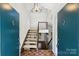 Bright entryway with a staircase, parquet flooring, modern light fixture, and a view to the upper level at 1419 Jules Ct, Charlotte, NC 28226