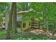 This home has a screened in porch and beautiful natural landscaping with mature trees surrounding the property at 1419 Jules Ct, Charlotte, NC 28226
