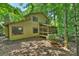 The home has mature trees surrounding the property with a screened in porch perfect for enjoying the outdoors at 1419 Jules Ct, Charlotte, NC 28226