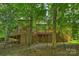 This home features a large deck with steps that lead to the backyard, and lattice trim at 1419 Jules Ct, Charlotte, NC 28226