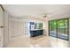 Open kitchen with a spacious island, white cabinets and appliances, and sliding glass doors to a deck at 1419 Jules Ct, Charlotte, NC 28226