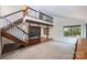 Spacious living room with hardwood floors and a staircase leading to the second level with railing at 1419 Jules Ct, Charlotte, NC 28226