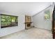 Bright living room features a stone fireplace with a raised hearth and views of the surrounding landscape at 1419 Jules Ct, Charlotte, NC 28226