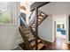 Cozy stairwell has carpeted steps, wooden banisters with steel railings and leads to the kitchen at 1419 Jules Ct, Charlotte, NC 28226
