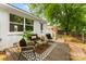 Cozy back deck with outdoor seating, perfect for relaxing in this charming home at 1426 Larkfield Ln, Charlotte, NC 28210