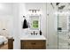 Contemporary bathroom with glass-enclosed shower, sleek vanity, and illuminated mirror at 1426 Larkfield Ln, Charlotte, NC 28210