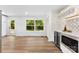 Modern kitchen featuring stainless steel appliances, white cabinets, and hardwood floors at 1426 Larkfield Ln, Charlotte, NC 28210