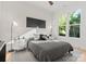 Bright bedroom featuring hardwood floors, large window, and stylish decor at 1622 Burtonwood Cir, Charlotte, NC 28212
