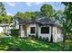 Beautiful white brick house with wooden columns and manicured lawn, perfect for curb appeal at 1622 Burtonwood Cir, Charlotte, NC 28212
