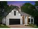 Inviting home exterior with a white brick facade, dark window trim, and a stylish covered front entrance at 1622 Burtonwood Cir, Charlotte, NC 28212
