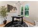 Bright office space with hardwood floors and a large window at 1622 Burtonwood Cir, Charlotte, NC 28212