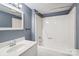 Well-maintained bathroom with a single sink vanity, large mirror, and a shower-tub combination at 1626 W Park Ave, Albemarle, NC 28001