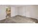 Cozy bedroom with soft carpeting, neutral walls, and direct access to an adjacent room at 1626 W Park Ave, Albemarle, NC 28001