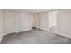 Spacious bedroom with neutral paint, gray carpet, and a closet at 1626 W Park Ave, Albemarle, NC 28001