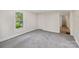 Bright, carpeted room with a window and neutral walls, perfect for relaxation at 1626 W Park Ave, Albemarle, NC 28001