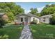 Quaint home featuring a walkway, lush lawn, and traditional architectural details at 1626 W Park Ave, Albemarle, NC 28001