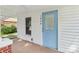 Inviting covered front porch with classic design and a bright blue door, adding charm at 1626 W Park Ave, Albemarle, NC 28001