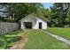 Exterior shot of the garage showing an open bay, side entry and grassy area at 1626 W Park Ave, Albemarle, NC 28001