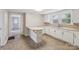 Bright kitchen with ample cabinet space and light countertops, complemented by neutral flooring and natural light at 1626 W Park Ave, Albemarle, NC 28001