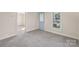 Cozy room with gray carpet and natural light, perfect as a bedroom or living space at 1626 W Park Ave, Albemarle, NC 28001