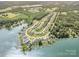 Stunning aerial view of a lakeside community with beautiful homes, private docks, and lush green landscaping at 183 Canoe Pole Ln, Mooresville, NC 28117