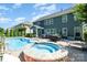 Beautiful backyard showcasing a pool and attached spa, along with a patio dining area, perfect for outdoor gatherings at 183 Canoe Pole Ln, Mooresville, NC 28117