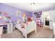 Bright bedroom with purple walls, a white bed frame, and lots of cute decorations for a  at 183 Canoe Pole Ln, Mooresville, NC 28117