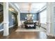 Formal dining area with natural light, stylish decor, and an ornate chandelier at 183 Canoe Pole Ln, Mooresville, NC 28117