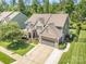 Beautiful home featuring stone accents, a well-manicured lawn, and an attached two-car garage at 183 Canoe Pole Ln, Mooresville, NC 28117