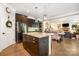 Well-equipped kitchen with a center island, stainless steel appliances, and seamless connection to the living room at 183 Canoe Pole Ln, Mooresville, NC 28117