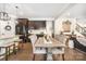 Kitchen and dining area featuring a kitchen island, stainless steel appliances, and hardwood floors at 183 Canoe Pole Ln, Mooresville, NC 28117