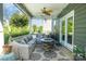 Outdoor patio with comfortable seating, a ceiling fan, and a cozy fire pit feature at 183 Canoe Pole Ln, Mooresville, NC 28117