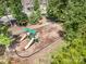Community playground featuring slides, swings, and a seating area, perfect for families with children at 183 Canoe Pole Ln, Mooresville, NC 28117