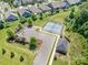 Aerial shot showcasing a community tennis court, parking, and a gazebo in a well-maintained neighborhood at 183 Canoe Pole Ln, Mooresville, NC 28117