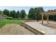 Backyard area featuring a deck, gravel area, and a wooden fence at 1986 Trace Creek Dr, Waxhaw, NC 28173