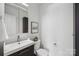 A minimalist bathroom featuring a modern vanity, toilet, and neutral decor at 1986 Trace Creek Dr, Waxhaw, NC 28173