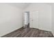 A charming bedroom boasts neutral paint, wood-look flooring and a bright airy feel at 1986 Trace Creek Dr, Waxhaw, NC 28173
