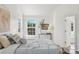 A bright bedroom has large windows with natural light and modern luxury decor at 1986 Trace Creek Dr, Waxhaw, NC 28173